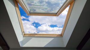 attic-window-view-blue-sky-white-clouds